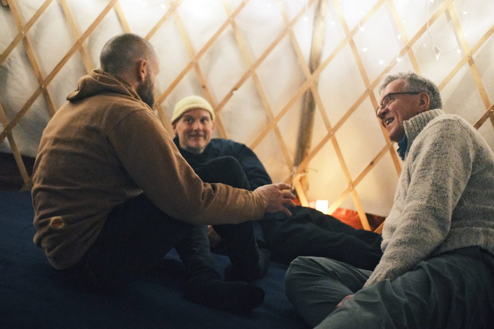 three men at mantra building Men’s brotherhood network